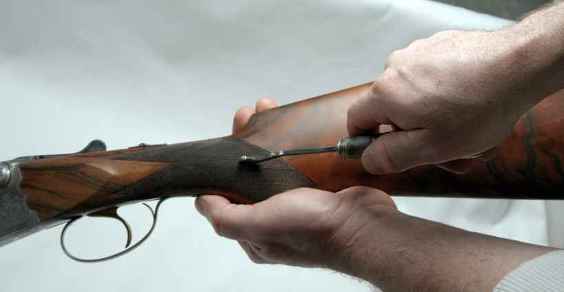 Hand checkered buttstock with point pattern checkering Hand checkered buttstock with point pattern checkering