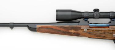 7mm left handed custom rifle with fleur-de-lis checkering